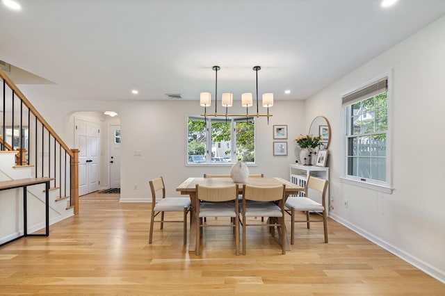 11 Dean Ct, Rutherford, NJ 07070 - dining area with arched walkways, recessed lighting, light wood-type flooring, and stairs