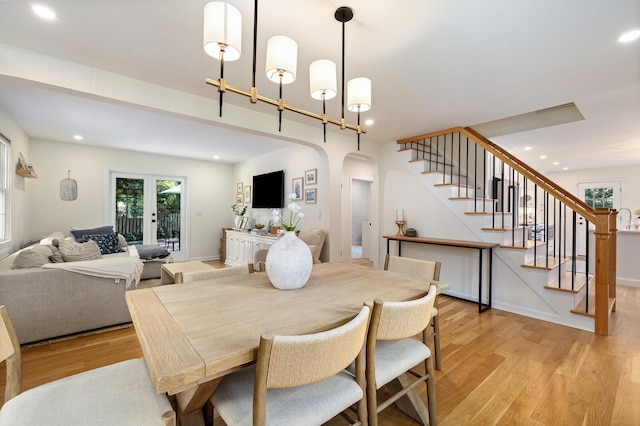 11 Dean Ct, Rutherford, NJ 07070 - dining room featuring arched walkways, stairs, light wood-style flooring, and recessed lighting
