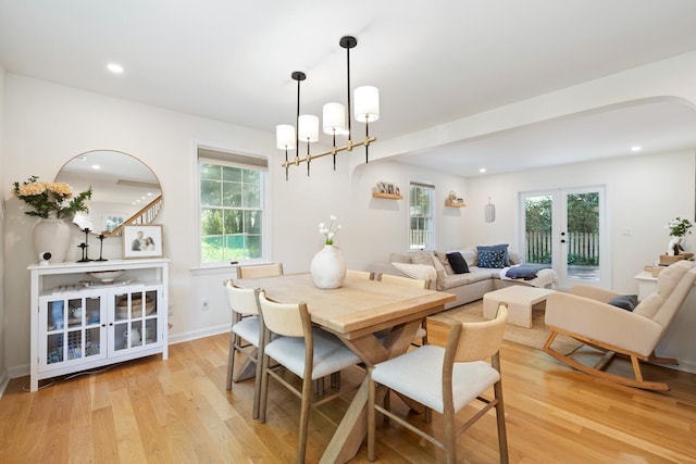 11 Dean Ct, Rutherford, NJ 07070 - dining area with light wood finished floors, healthy amount of natural light, arched walkways, french doors, and recessed lighting