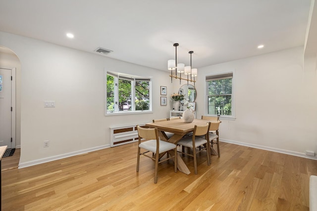 11 Dean Ct, Rutherford, NJ 07070 - dining room with light wood finished floors, arched walkways, and recessed lighting