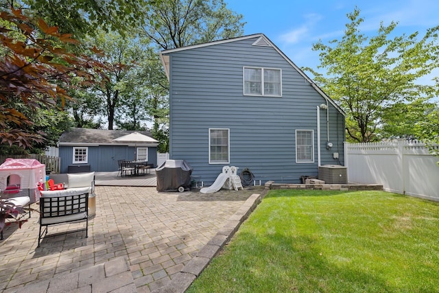 11 Dean Ct, Rutherford, NJ 07070 - rear view of property featuring a fenced backyard, a patio, and an outdoor structure