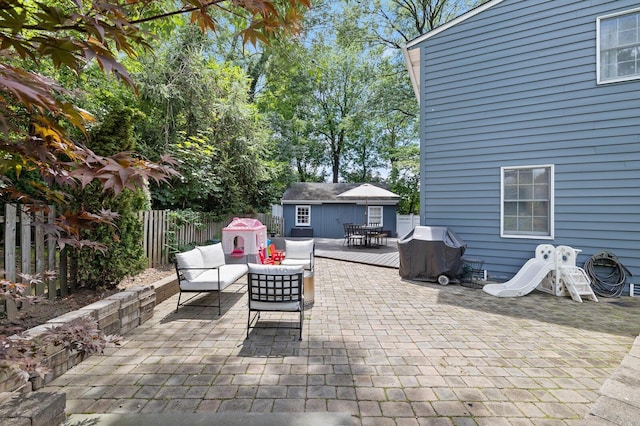 11 Dean Ct, Rutherford, NJ 07070 - fenced backyard with a grill, an outdoor living space, an outbuilding, a patio, and outdoor dining area