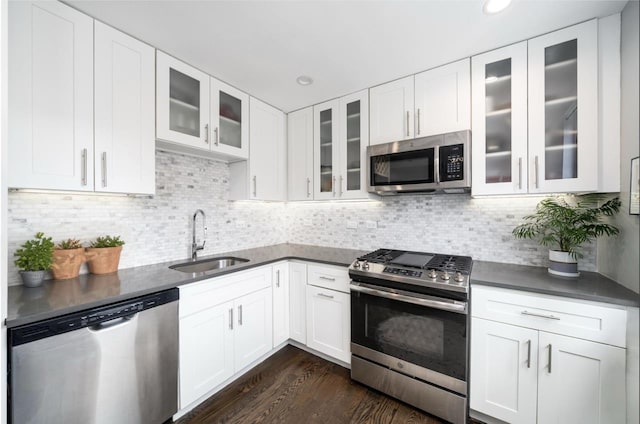 126 Delaware Ave Unit 12, Jersey City, NJ 07306 - kitchen with appliances with stainless steel finishes, dark countertops, white cabinetry, and recessed lighting