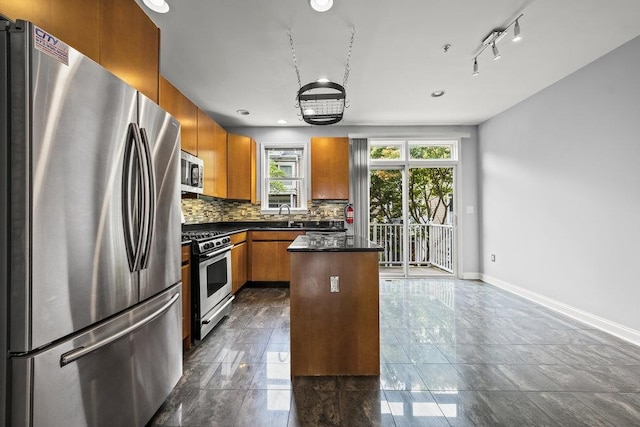 235 Price Ct, West New York, NJ 07093 - kitchen featuring stainless steel appliances, dark countertops, brown cabinetry, backsplash, and recessed lighting
