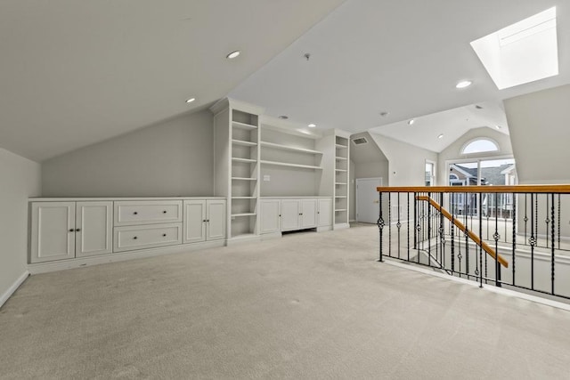 235 Price Ct, West New York, NJ 07093 - additional living space featuring lofted ceiling, a skylight, light colored carpet, recessed lighting, and built in shelves