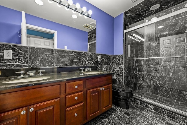 235 Price Ct, West New York, NJ 07093 - bathroom with marble finish flooring, double vanity, a marble finish shower, and tile walls