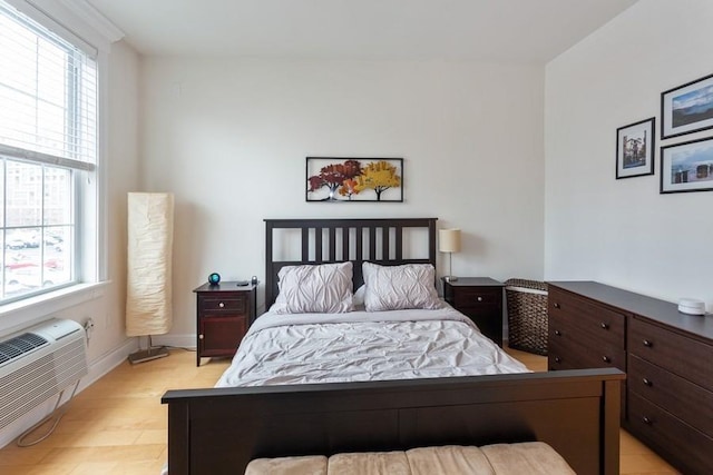 102 Tidewater St Unit 2B, Jersey City, NJ 07302 - bedroom with an AC wall unit and baseboards