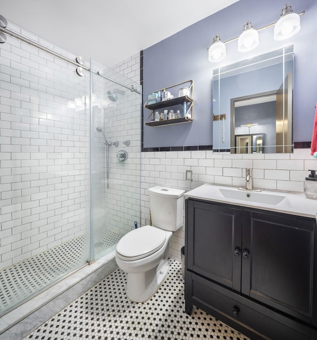 full bathroom with shower / bath combo, vanity, tile walls, tile patterned flooring, and toilet