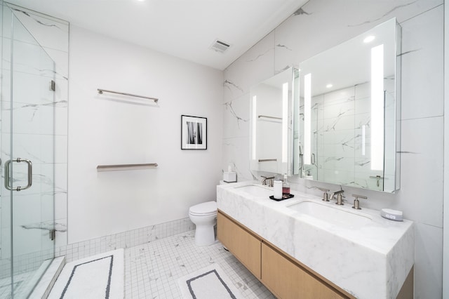 bathroom with a sink, a marble finish shower, toilet, and visible vents