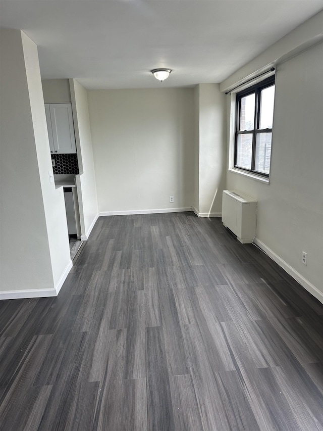 1225 Kennedy Blvd Unit 4J, Bayonne, NJ 07002 - unfurnished living room with dark wood-style flooring