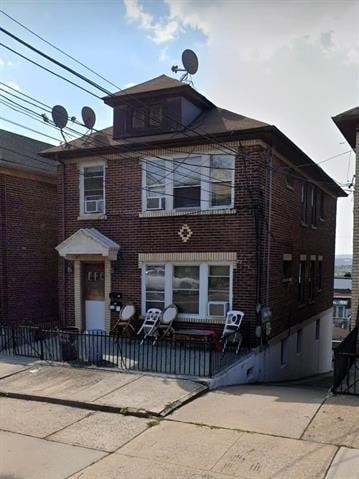 711 Grand Ave, North Bergen, NJ 07047 - view of property featuring brick siding and a patio