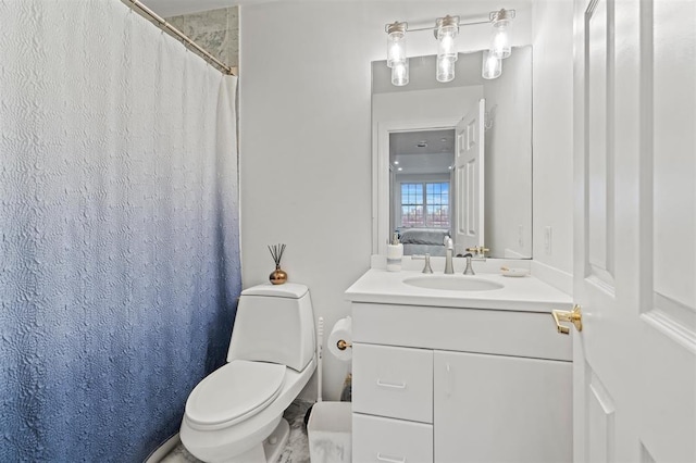 bathroom featuring a shower with shower curtain, toilet, and vanity
