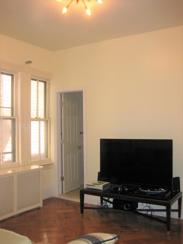 living room with parquet floors and radiator