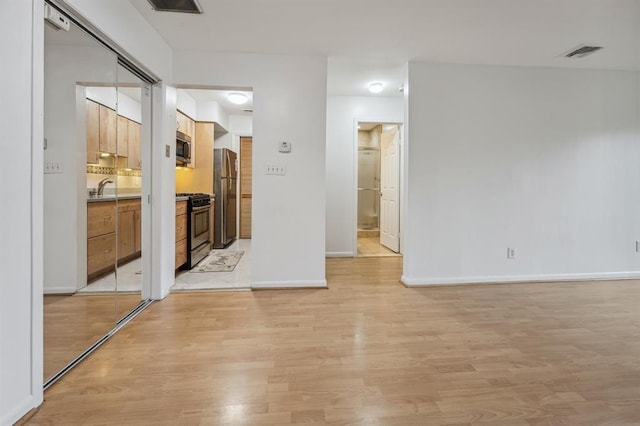 603 55th St Unit 210, West New York, NJ 07093 - spare room with light wood-style floors and baseboards