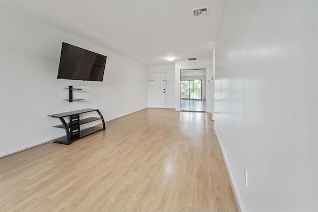 603 55th St Unit 210, West New York, NJ 07093 - unfurnished living room with light wood-type flooring and baseboards