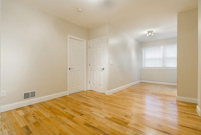 330 2nd St, Jersey City, NJ 07302 - empty room featuring light wood-style flooring and baseboards