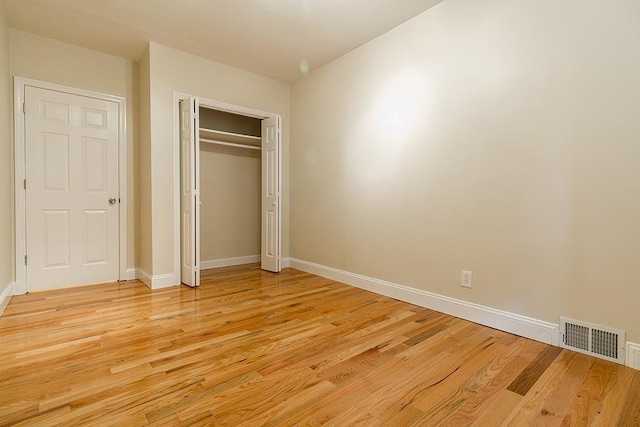 330 2nd St, Jersey City, NJ 07302 - unfurnished bedroom with light wood finished floors, baseboards, and a closet