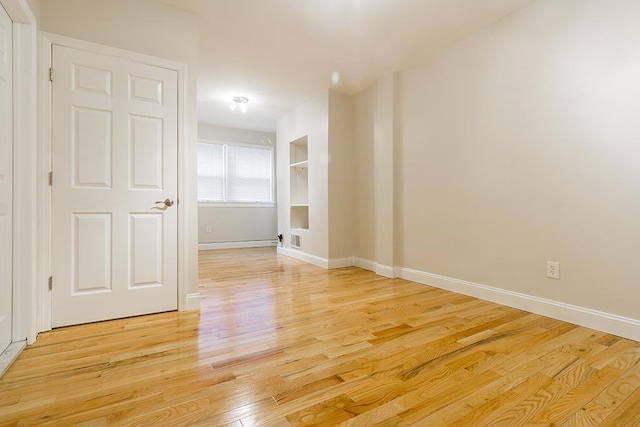 330 2nd St, Jersey City, NJ 07302 - spare room featuring light wood-style flooring and baseboards