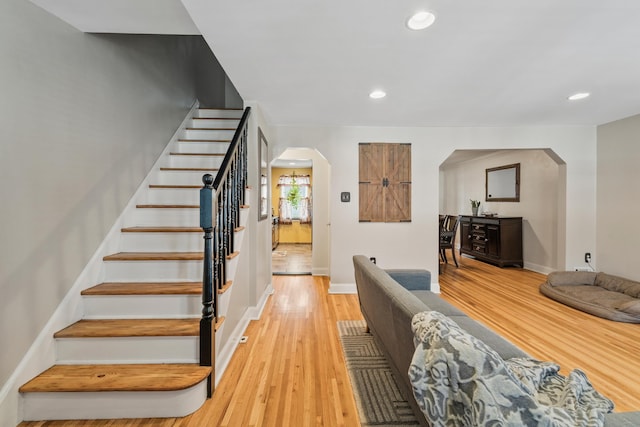 12 Egan Ct, Bayonne, NJ 07002 - stairs featuring arched walkways, wood finished floors, and recessed lighting
