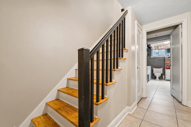 12 Egan Ct, Bayonne, NJ 07002 - staircase featuring tile patterned floors and baseboards