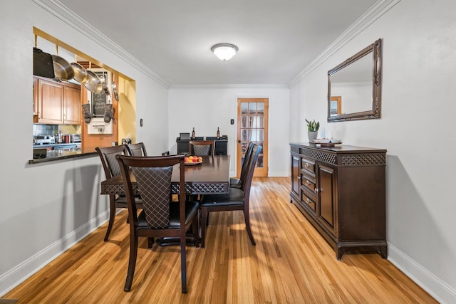 12 Egan Ct, Bayonne, NJ 07002 - dining area featuring light wood-style floors and crown molding