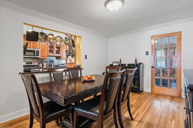 12 Egan Ct, Bayonne, NJ 07002 - dining space featuring light wood-style floors and ornamental molding