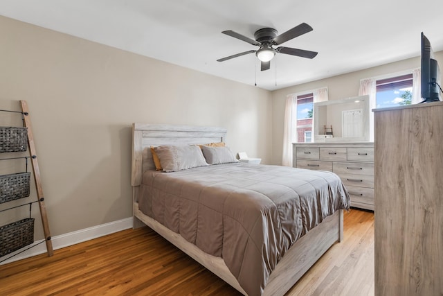 12 Egan Ct, Bayonne, NJ 07002 - bedroom with light wood-style floors and a ceiling fan