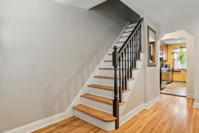 12 Egan Ct, Bayonne, NJ 07002 - stairs with wood finished floors and arched walkways
