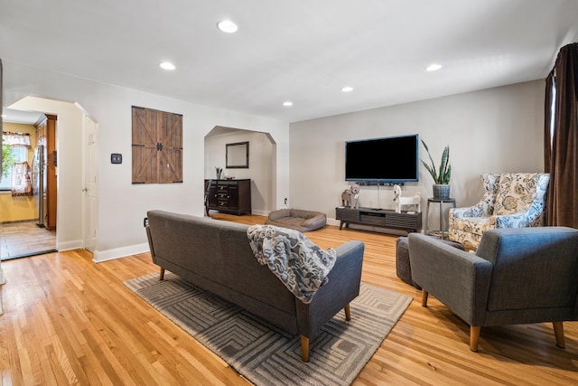 12 Egan Ct, Bayonne, NJ 07002 - living area featuring arched walkways, recessed lighting, and light wood-type flooring