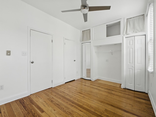522 Jefferson St Unit 3, Hoboken, NJ 07030 - unfurnished bedroom with two closets, hardwood / wood-style flooring, ceiling fan, and baseboards
