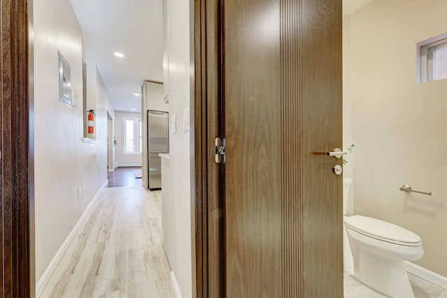 hallway featuring light wood-type flooring