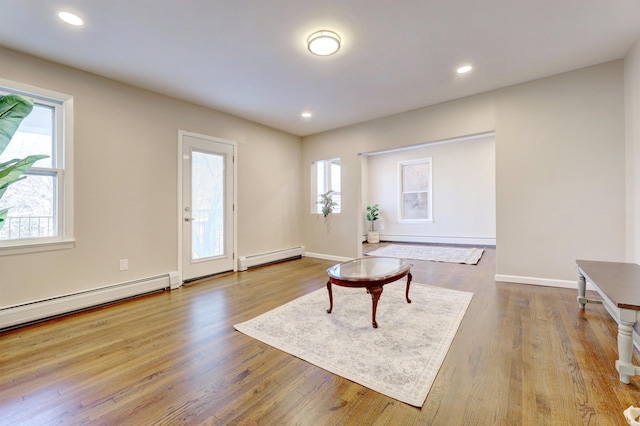 interior space featuring light hardwood / wood-style flooring and baseboard heating