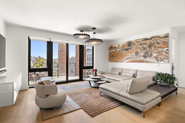 720 Clinton St Unit 603, Hoboken, NJ 07030 - living room featuring light wood-type flooring