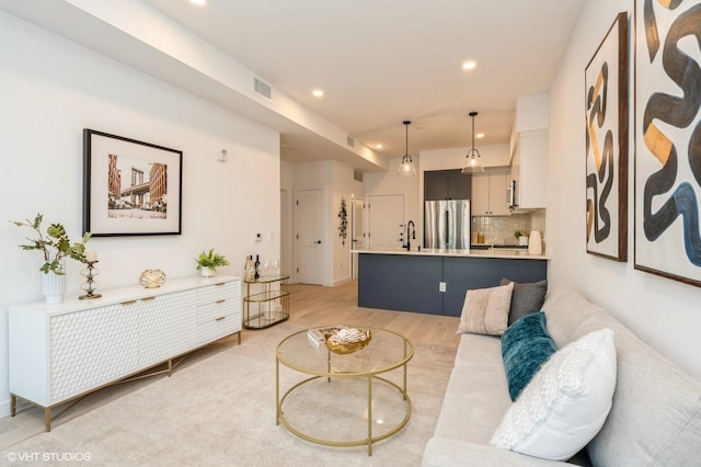 425 3rd St Unit 318, Jersey City, NJ 07302 - living room featuring light wood-style flooring and recessed lighting