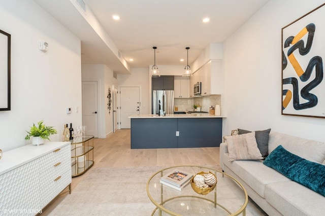 425 3rd St Unit 318, Jersey City, NJ 07302 - living room featuring light wood-style flooring and recessed lighting