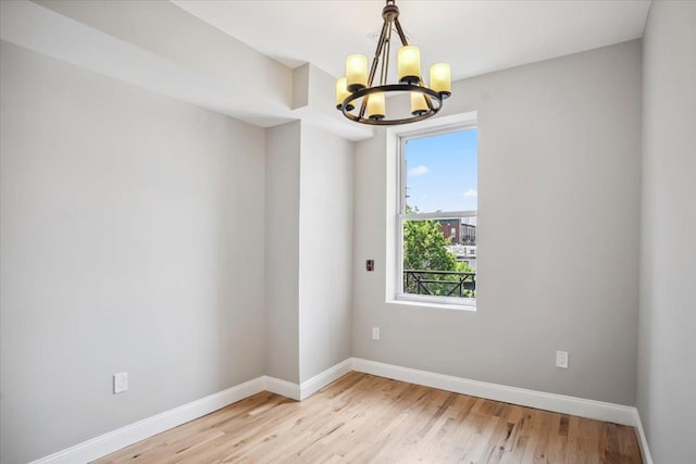 159 14th St Unit 4R, Hoboken, NJ 07030 - spare room with a chandelier and light wood-style floors