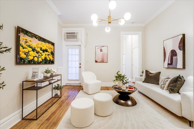 living room with crown molding, an AC wall unit, hardwood / wood-style floors, and an inviting chandelier