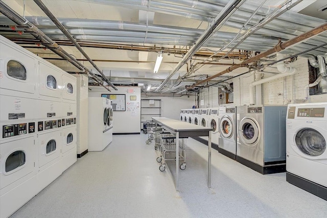 laundry area featuring stacked washer / drying machine and washing machine and dryer