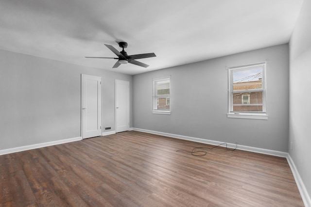 11 Veterans Ct, Bayonne, NJ 07002 - unfurnished bedroom with dark wood-type flooring and a ceiling fan