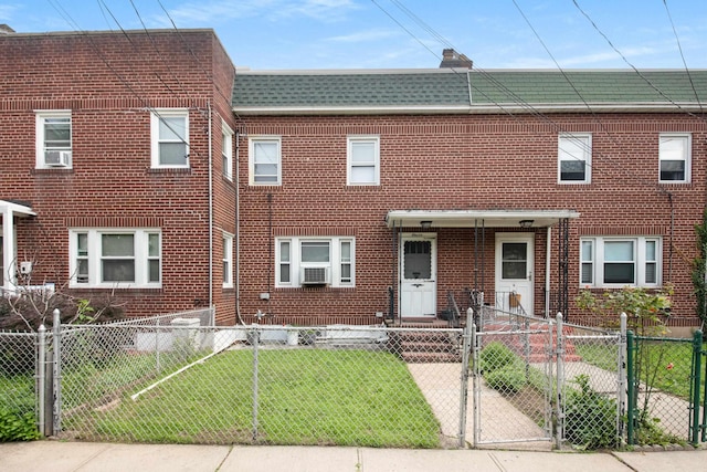 11 Veterans Ct, Bayonne, NJ 07002 - view of property featuring brick siding, a fenced front yard, and a gate