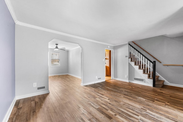 11 Veterans Ct, Bayonne, NJ 07002 - unfurnished living room with stairway, crown molding, wood finished floors, ceiling fan, and arched walkways