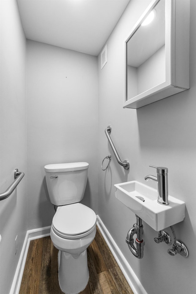 11 Veterans Ct, Bayonne, NJ 07002 - half bath with wood finished floors and toilet