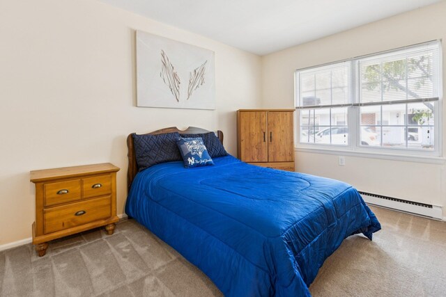 1072 Argyll Cir, Lakewood Township, NJ 08701 - bedroom featuring a baseboard radiator, carpet flooring, and baseboards
