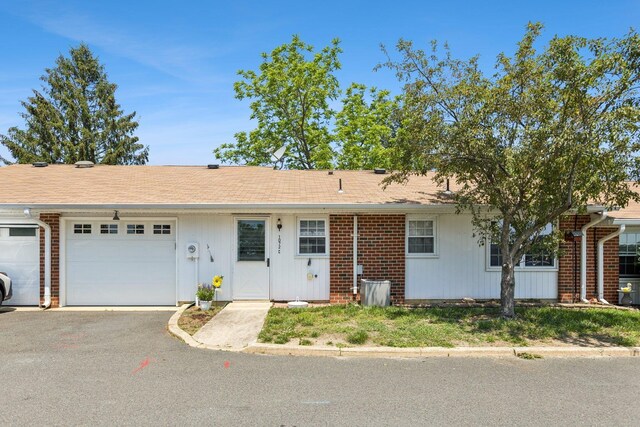 1072 Argyll Cir, Lakewood Township, NJ 08701 - ranch-style house featuring a garage, brick siding, asphalt driveway, and a shingled roof