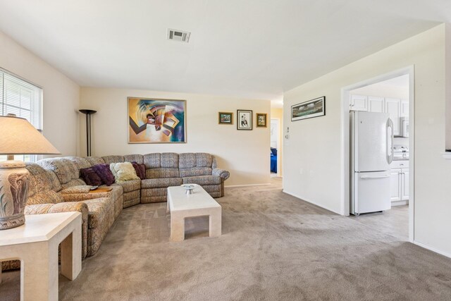 1072 Argyll Cir, Lakewood Township, NJ 08701 - living area with light carpet and baseboards