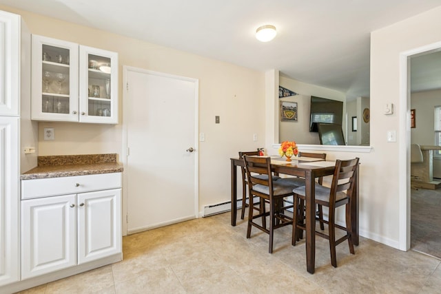 1072 Argyll Cir, Lakewood Township, NJ 08701 - dining space featuring a baseboard heating unit, baseboards, and light tile patterned flooring