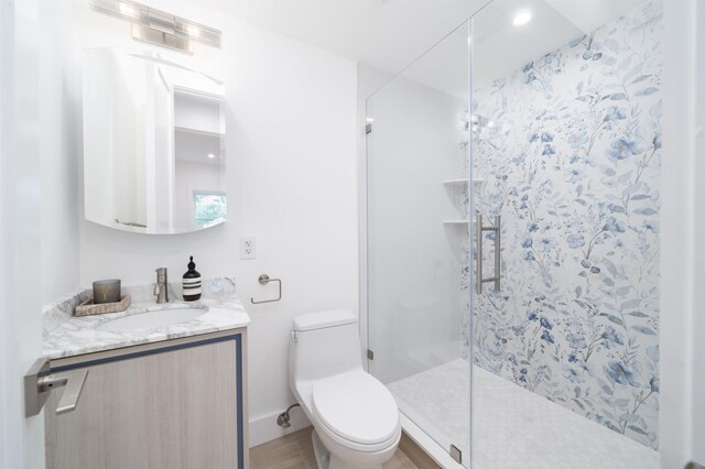 90 Monroe St Unit 2, Hoboken, NJ 07030 - bathroom featuring a shower stall, toilet, vanity, and recessed lighting