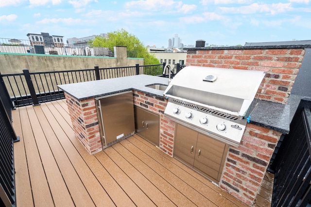 90 Monroe St Unit 2, Hoboken, NJ 07030 - wooden deck featuring a sink, grilling area, and exterior kitchen