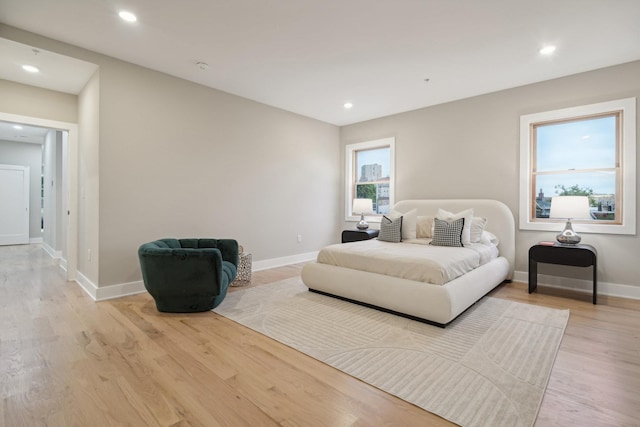 bedroom with light hardwood / wood-style floors