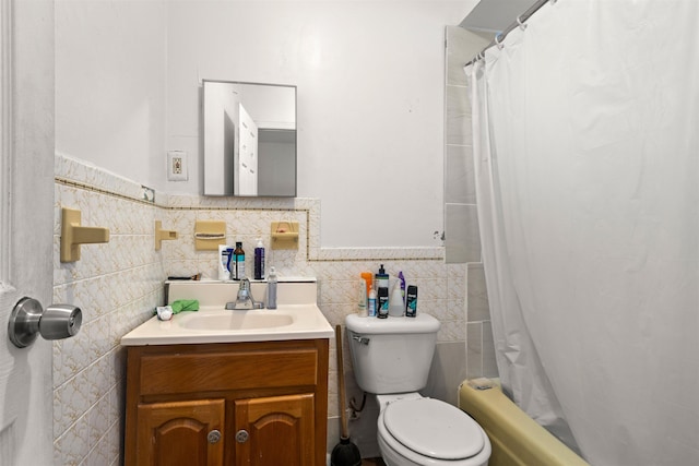 218 68th St, Guttenberg, NJ 07093 - bathroom featuring tile walls, vanity, shower / bath combo, and wainscoting